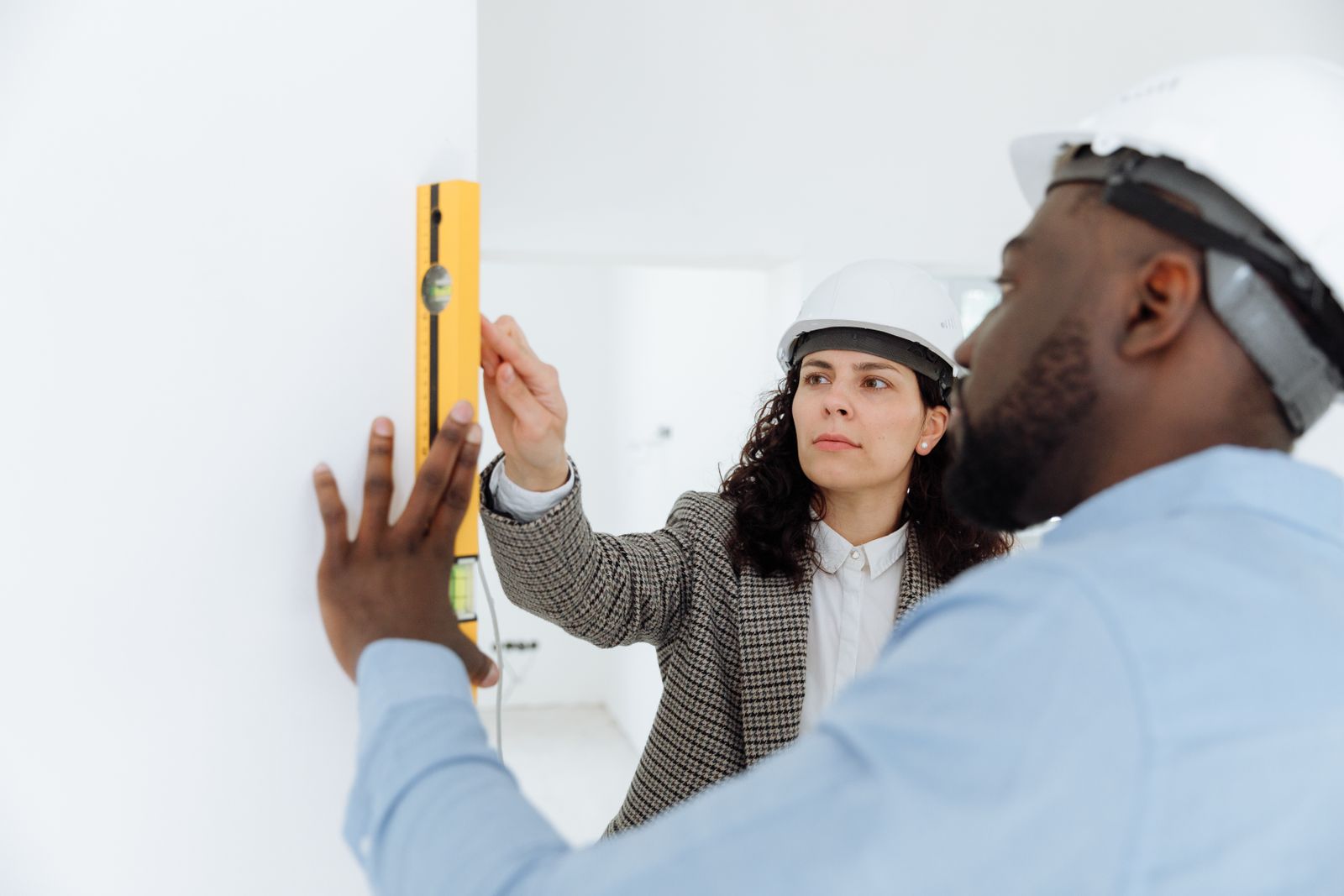 Contractors reviewing measurements